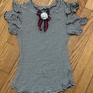 Women’s rayon/spandex black & white stripped top with broach.